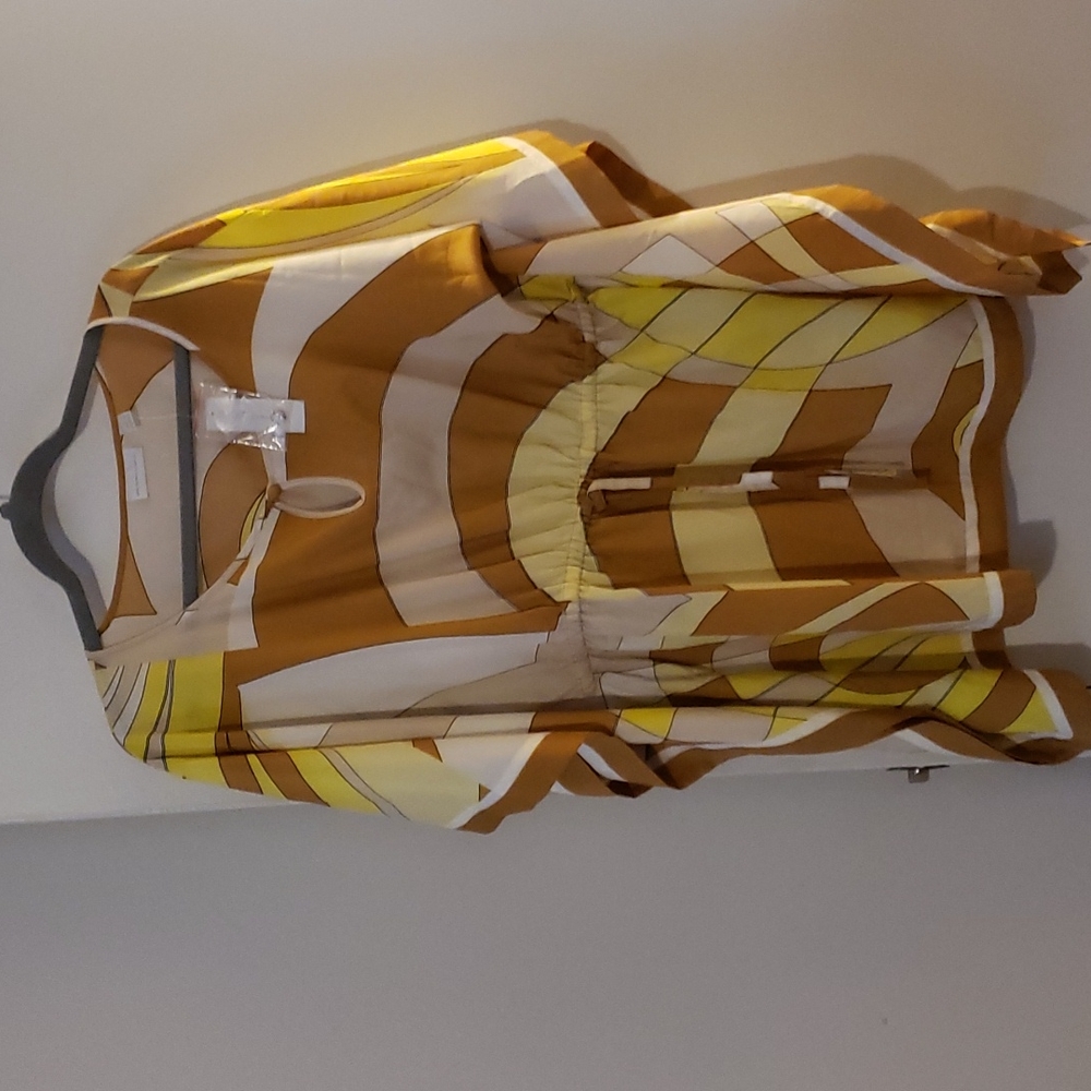 Brown yellow and tan peplum flowy dress shirt. Draw string tightensin the front.